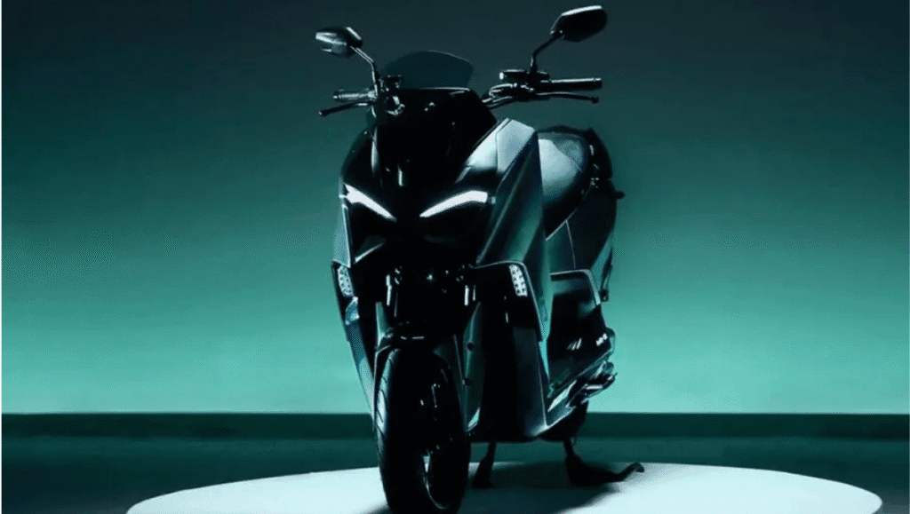 Close-up front view of the 2026 TVS M1-S Electric Maxi-Scooter with LED DRLs and projector headlamp