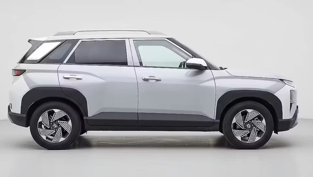 2025 Hyundai Venue side profile view with roof rails and alloy wheels