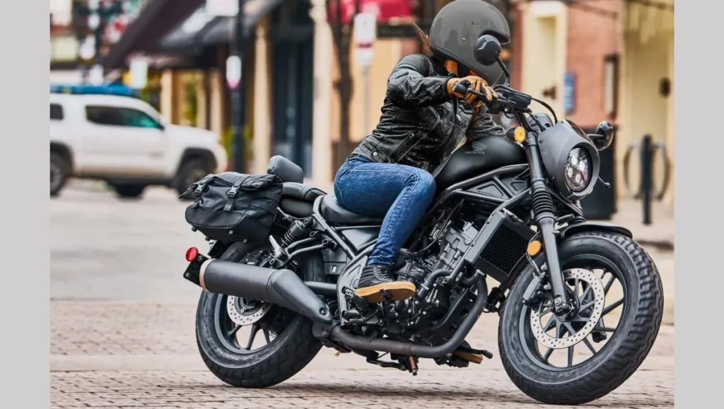 Rider cruising on 2026 Honda Rebel 300 E-Clutch demonstrating clutchless gear shifting technology