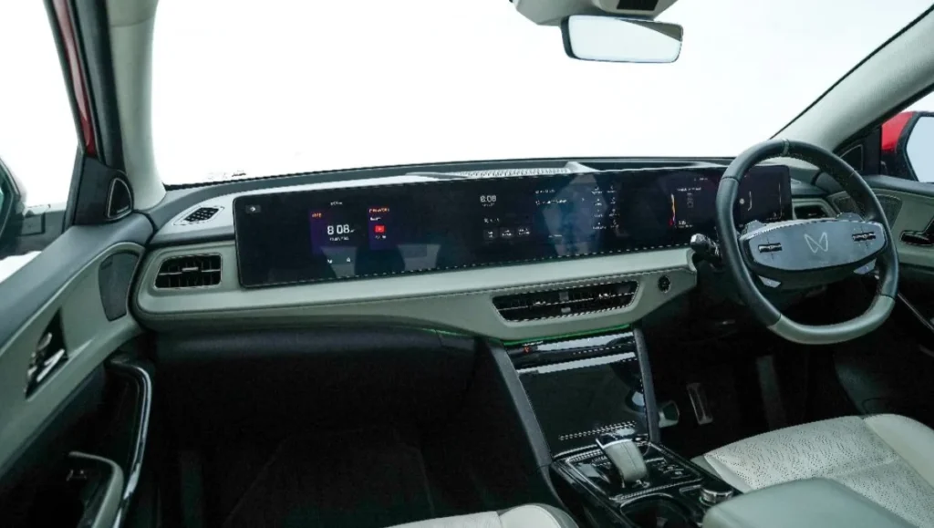 Mahindra XEV 9S interior featuring tri-screen dashboard and futuristic steering design