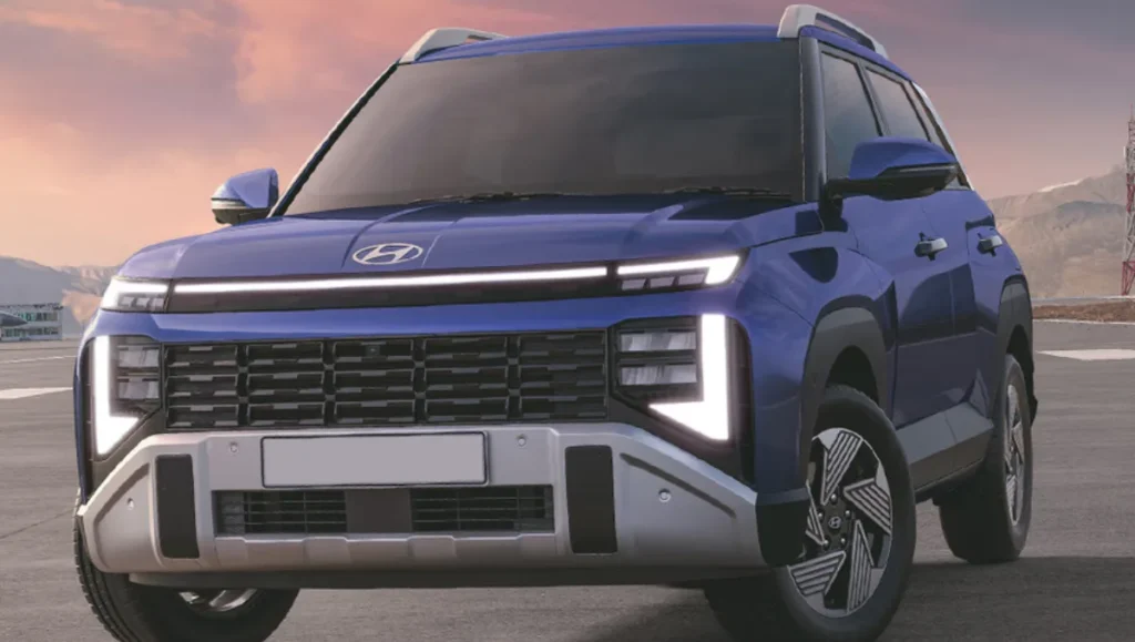 2025 Hyundai Venue front left view in blue with LED headlamps and new grille design