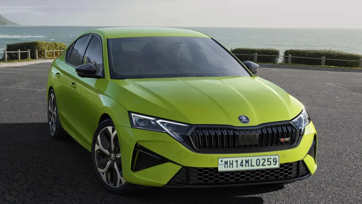 New Skoda Octavia RS review green performance sedan front view parked near the coastline