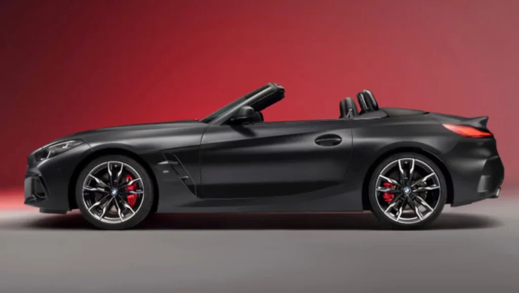Side view of the BMW Z4 Final Edition in matte black with roof down