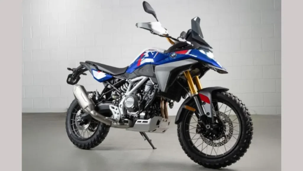 BMW F 450 GS adventure motorcycle front three-quarter view showcasing blue, white, and red livery with off-road tires.