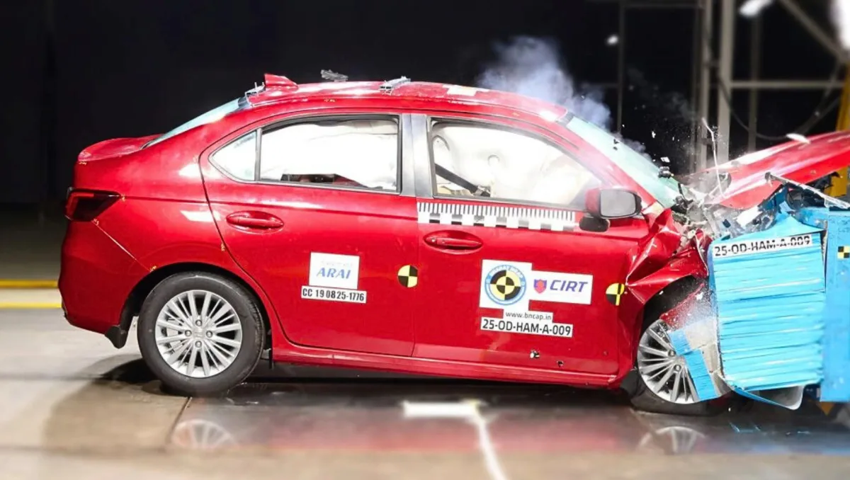 Red Honda Amaze crash test image showing frontal impact during Honda Amaze Scores 5 star BNCAP Rating test