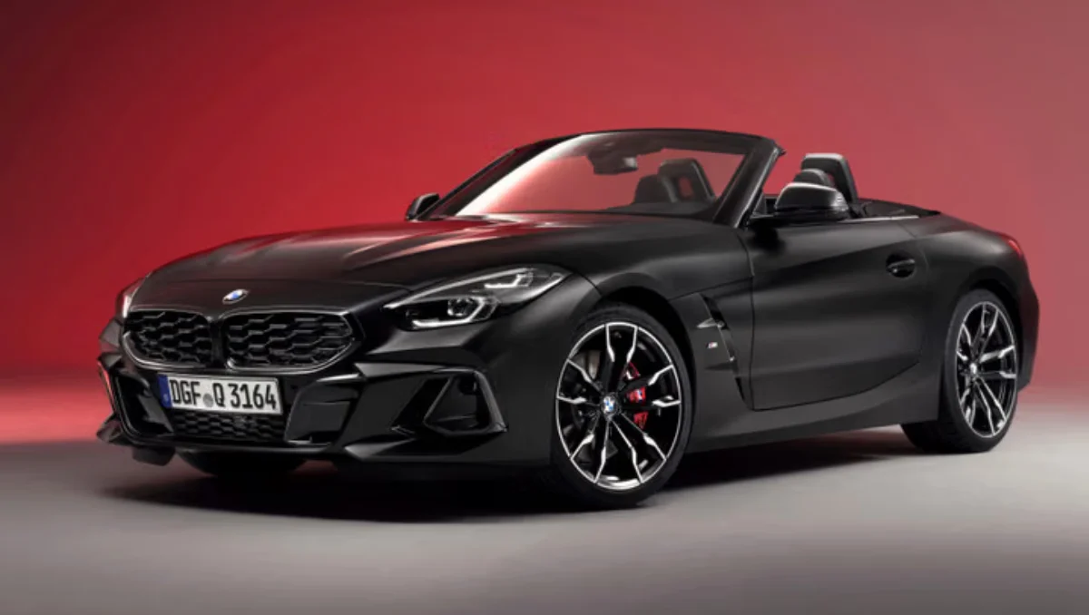 BMW Z4 Final Edition Revealed in matte black exterior on display under red studio lighting