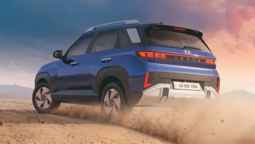 Rear view of New Gen Hyundai Venue 2025 driving through sand