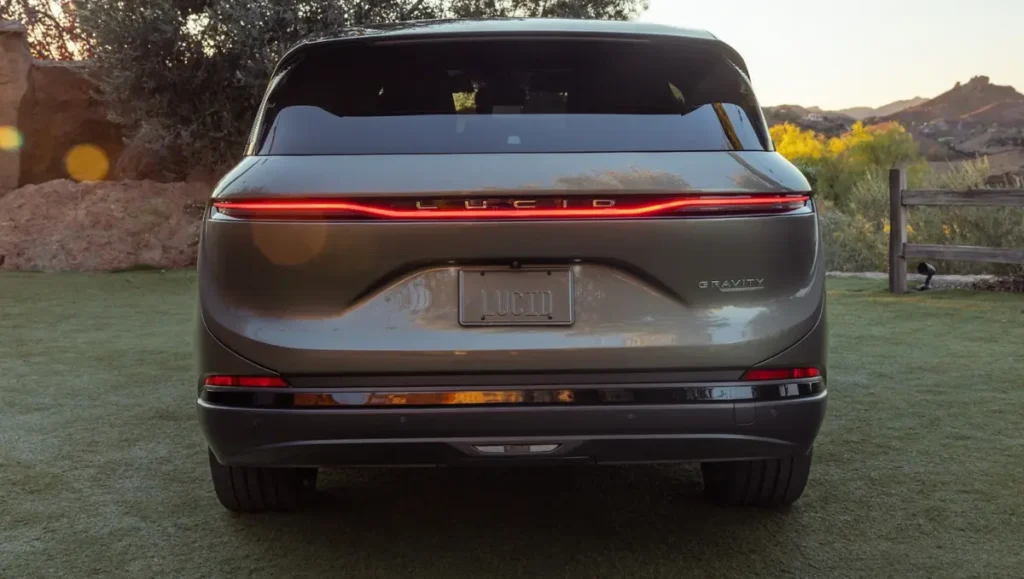 Rear view of Lucid Gravity Named Best Luxury Vehicle For 2026 with illuminated LED tail light bar