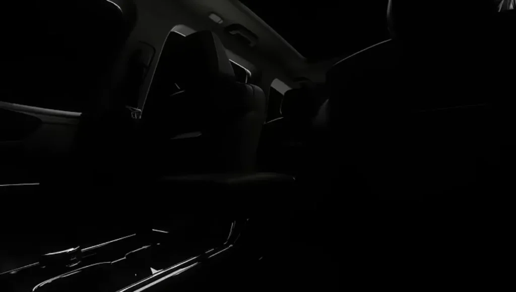 This image highlights the sophisticated dashboard layout of the Big New Electric XEV 9s, featuring a futuristic steering wheel, touchscreen instrumentation and a clean, driver-focused cockpit design.