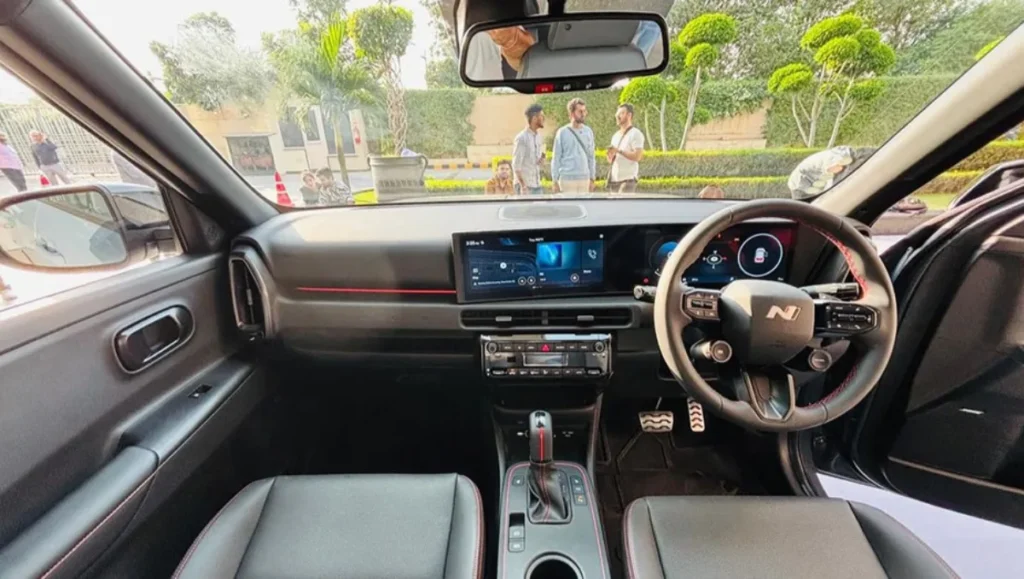 2025 Hyundai Venue N Line interior with all-black cabin and red accents
