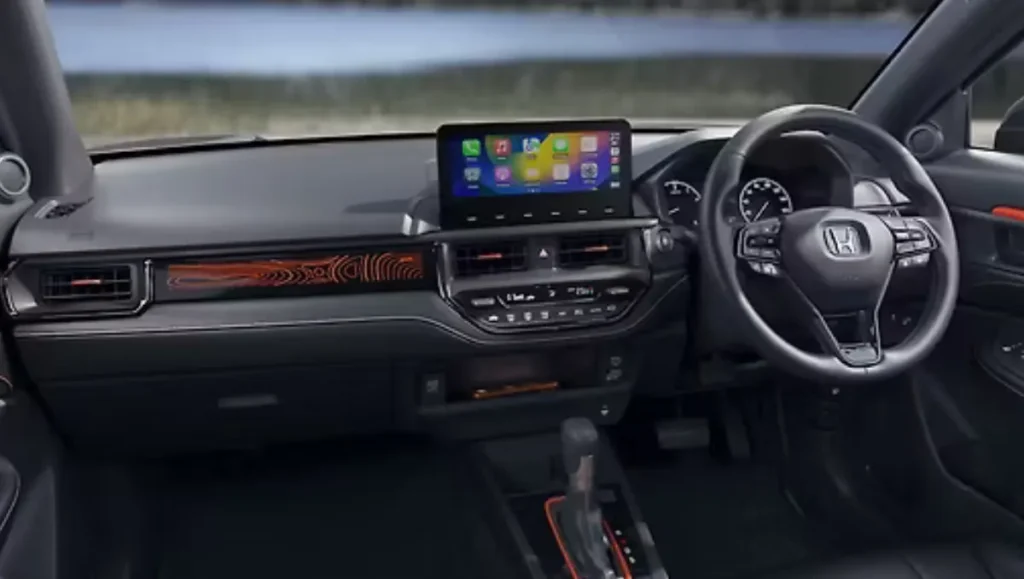 Dashboard of Honda Elevate ADV Edition with illuminated orange dash trim and touchscreen display