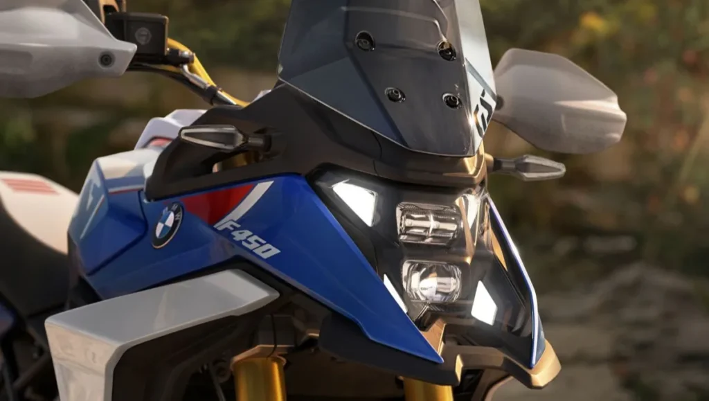 Front view of The BMW F 450 GS adventure motorcycle showing LED headlights and sporty blue design