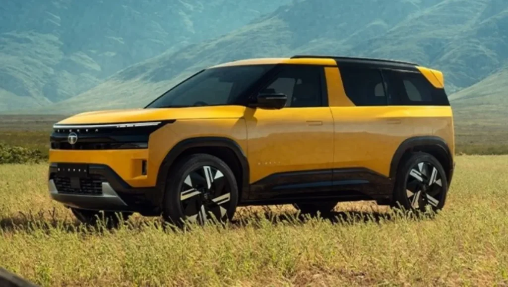 Tata Sierra Variant Wise Features 2025 yellow suv side profile in outdoor landscape