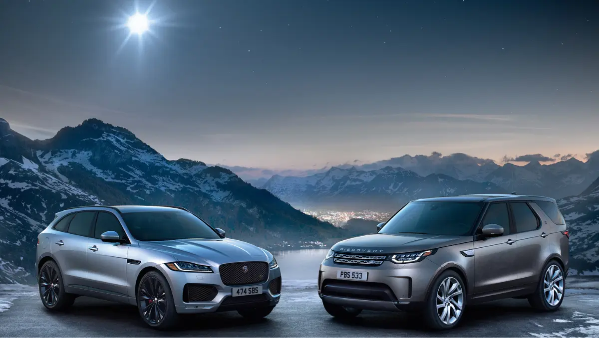 Jaguar and Land Rover SUVs parked in mountain backdrop after JLR disruption related to Tata Motors PV Q2 posts heavy loss