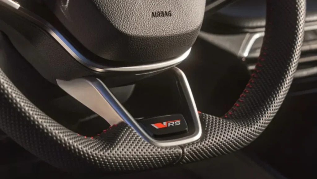 New Skoda Octavia RS review sporty steering wheel badge close-up