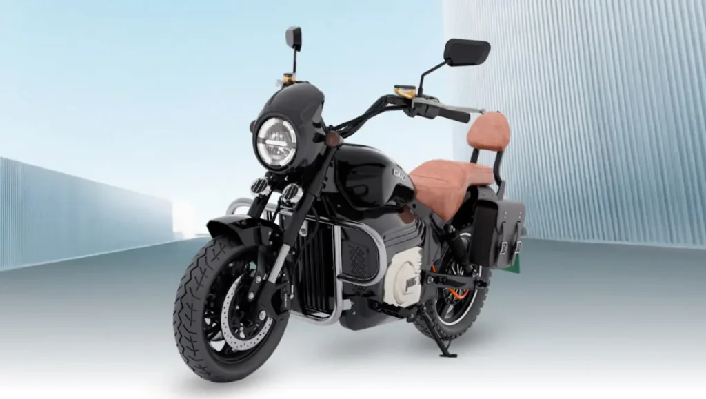komaki electric launches mx16 pro electric cruiser bike black cruiser model with tan seat on open background