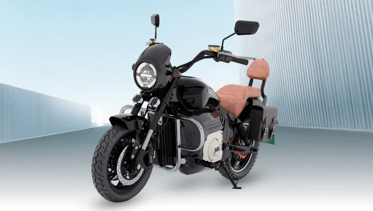komaki electric launches mx16 pro electric cruiser bike black cruiser model with tan seat on open background