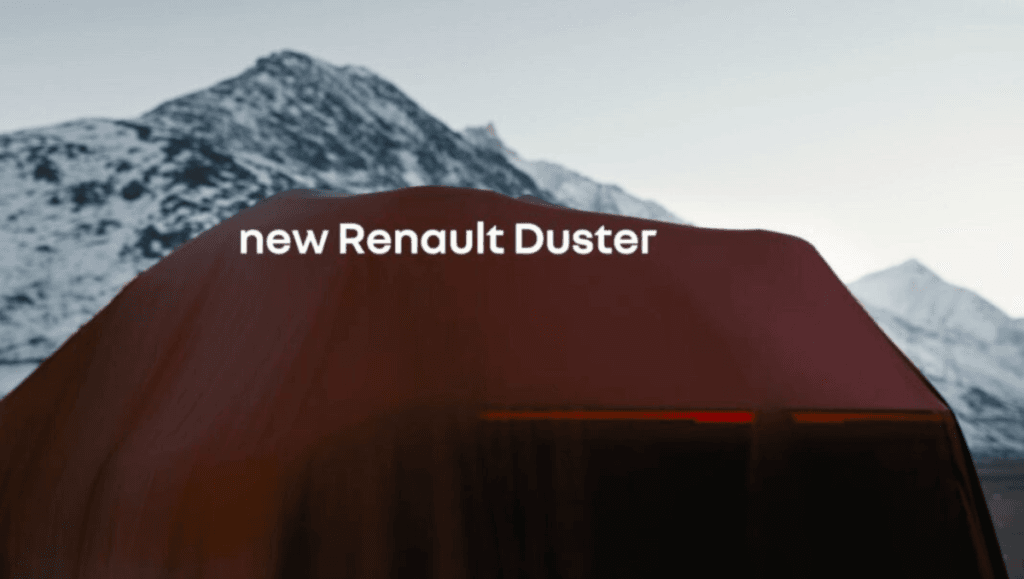 New Renault Duster teased ahead of India debut shown under cover with teaser text against a mountain backdrop in official preview image