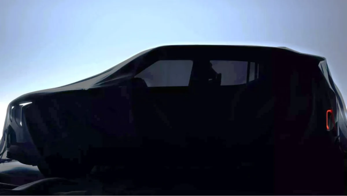Kia EV2 teaser image showing the first shadowed silhouette of the upcoming compact electric SUV