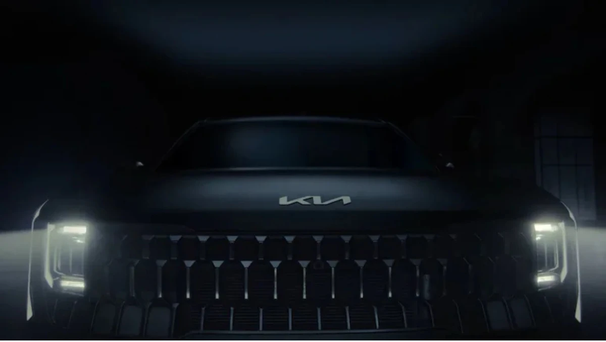 2026 Kia Seltos TEASED For The First Time front fascia in dark teaser shot