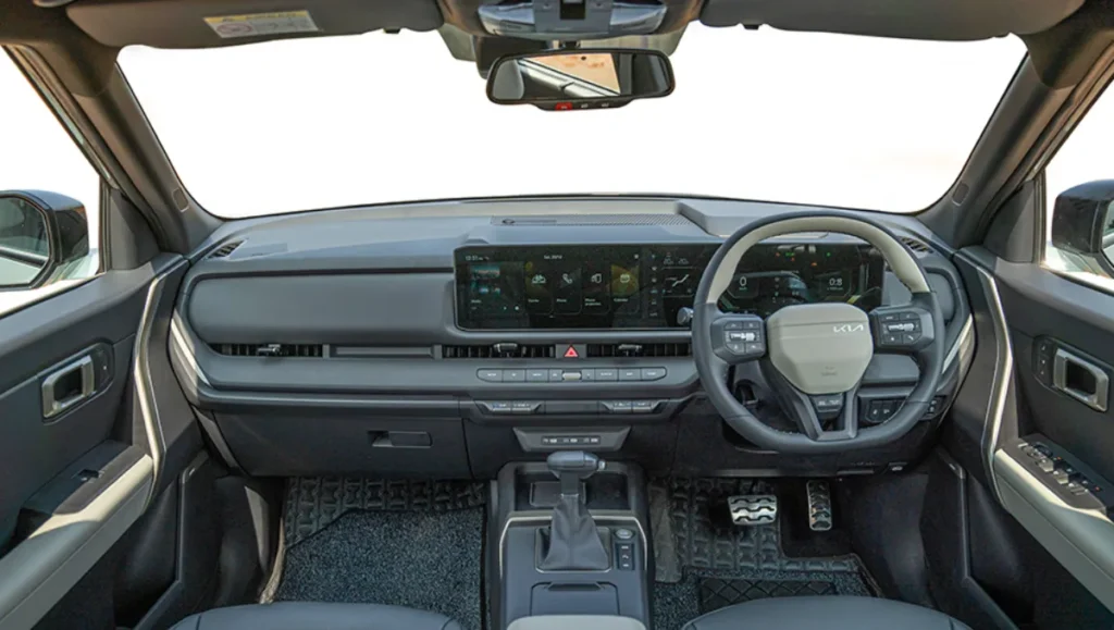 New 2026 Kia Seltos Launched in India interior showing updated dashboard layout, wide digital display, steering controls, and cabin design