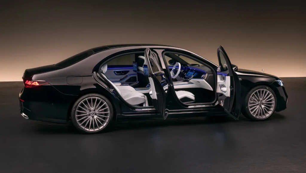 2026 Mercedes Benz S Class Facelift Revealed side profile with doors open showing luxury interior