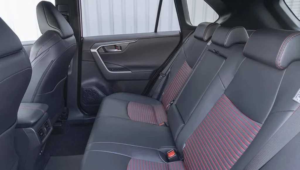 2026 Suzuki Across Revealed rear seat space with black and red upholstery