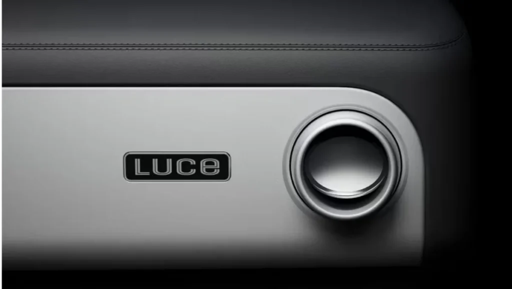 Ferrari Luce Interior Revealed dashboard air vent and Luce branding with minimalist aluminum finish