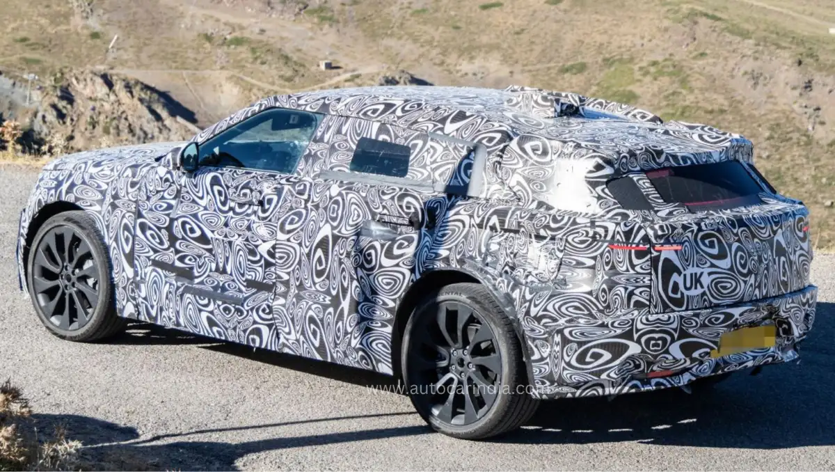 Range Rover Velar EV Spied during rear three quarter road testing with heavy camouflage