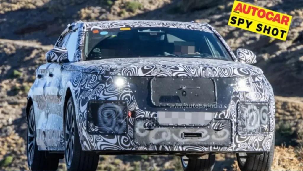 Range Rover Velar EV Spied front view prototype testing with covered grille and headlights
