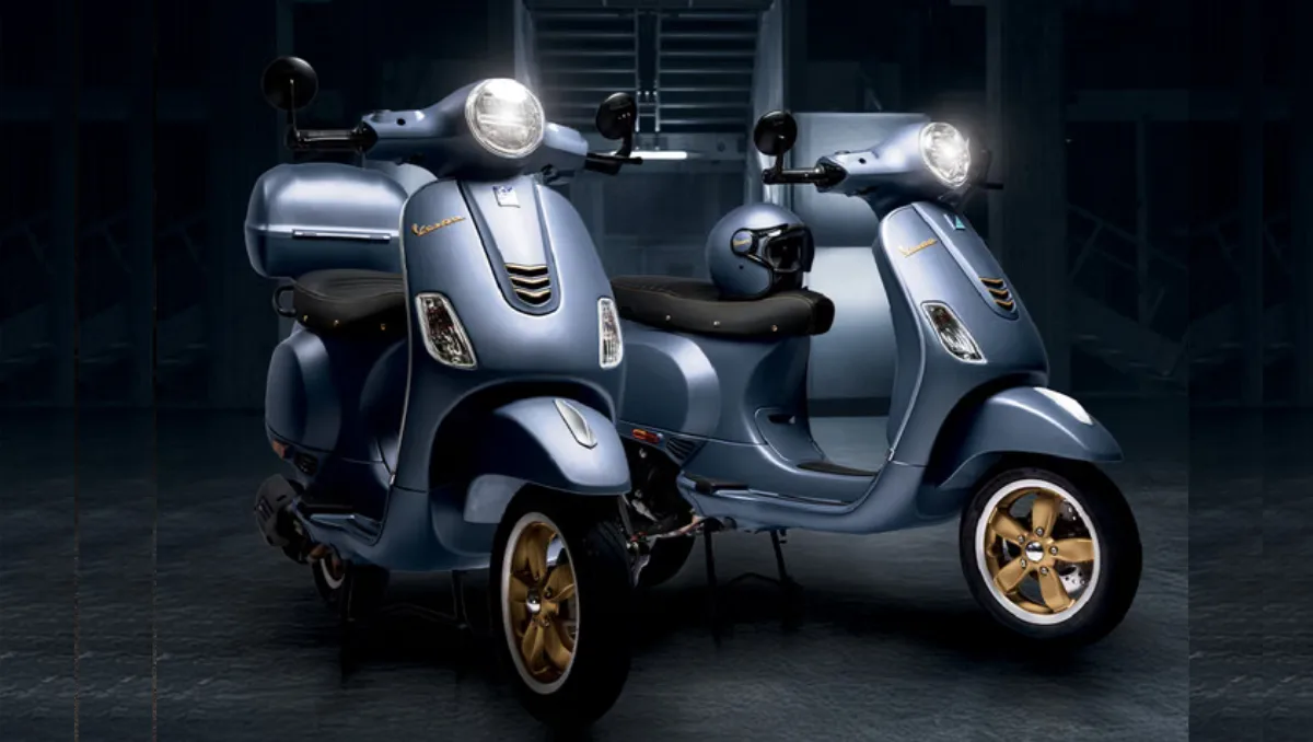 Vespa Officina 8 launched in matte blue color with gold alloy wheels displayed in studio lighting