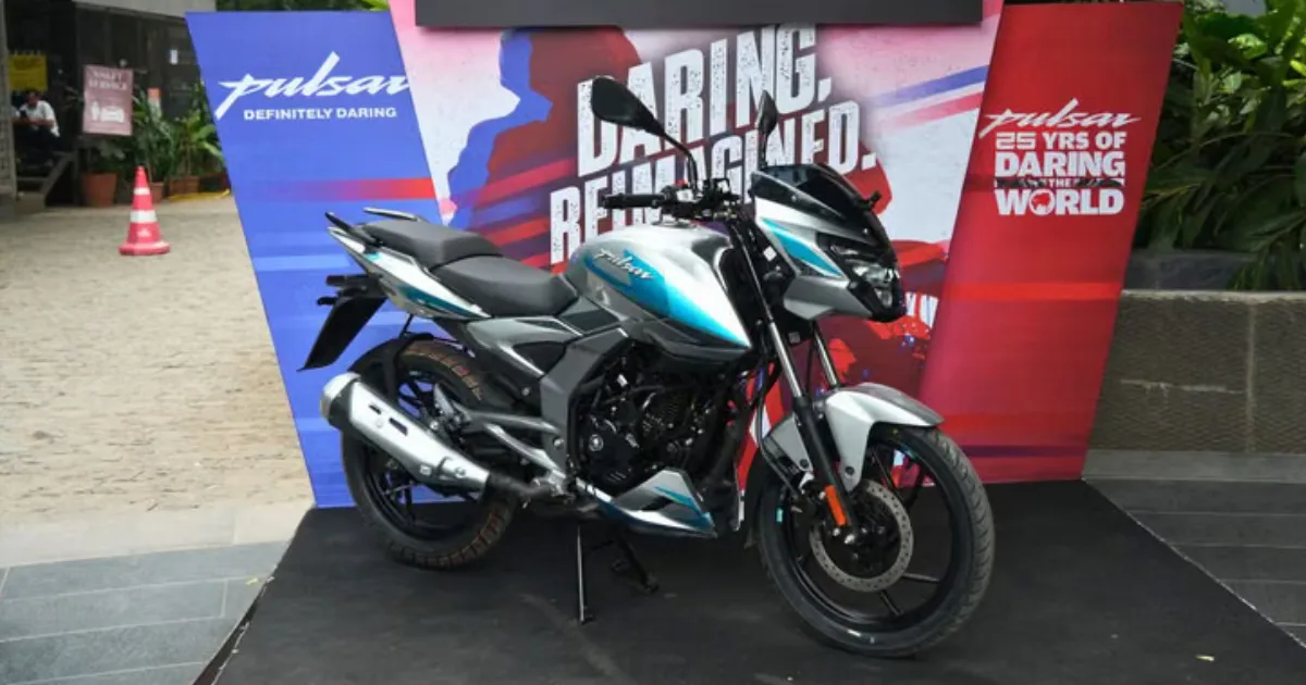 All-New Bajaj Pulsar 125 side profile view in silver and blue graphics on display platform